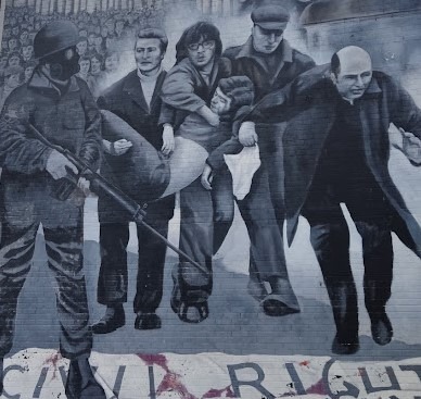 Mural portraying Edward Daly - Bishop of Derry during the events of Bloody Sunday